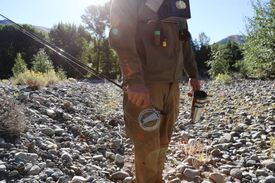 A man holds a Waterworks-Lamson reel.