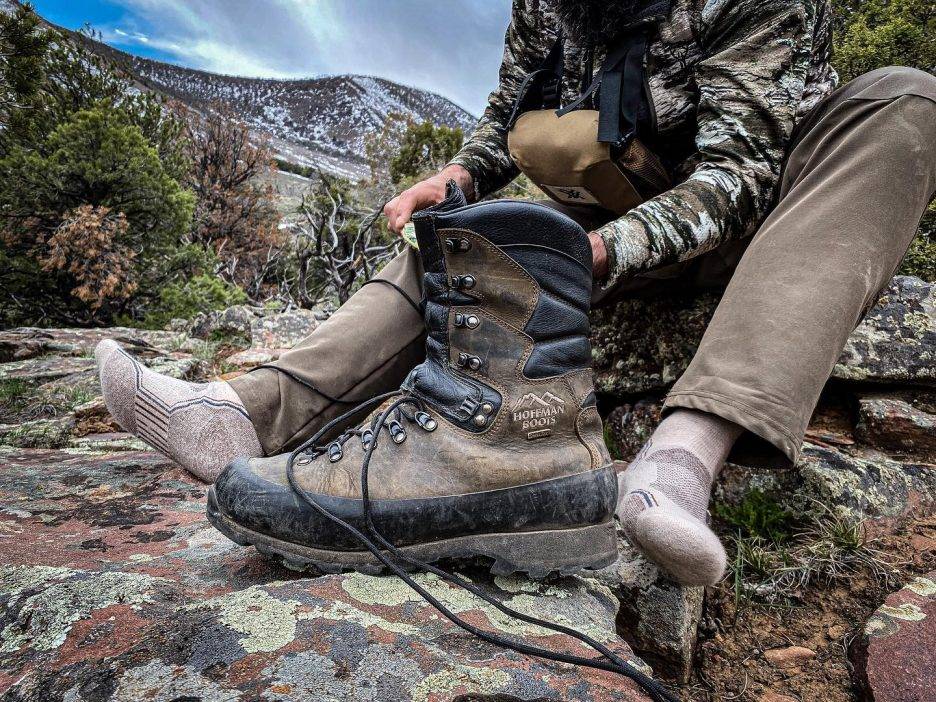 Outdoorsman sitting outside with a Hoffman boot.