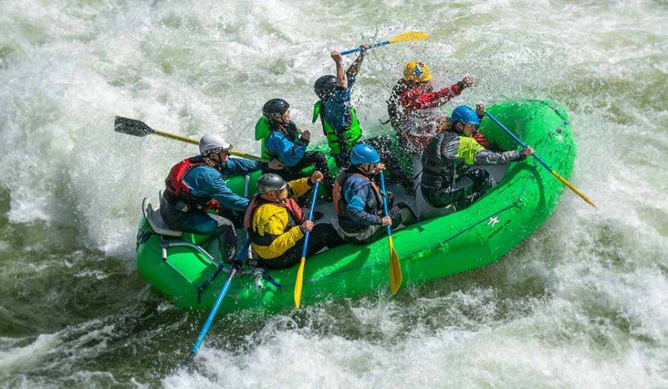Group of people whitewater rafting