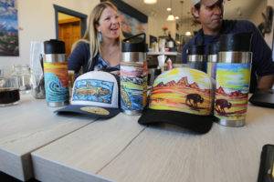 Liquid hardware owners sit in front of their product.